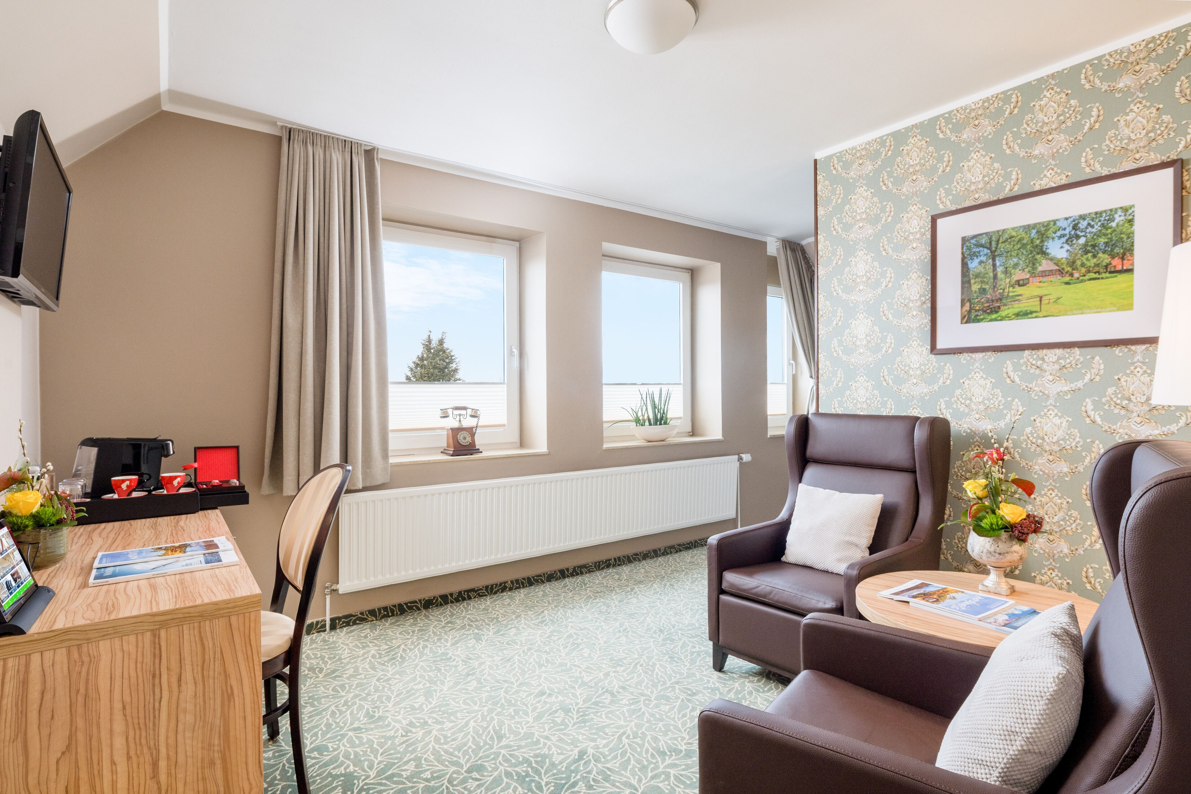 Deluxe Studio Suite | Living area | 100-cm flat-screen TV with cable channels, tablet