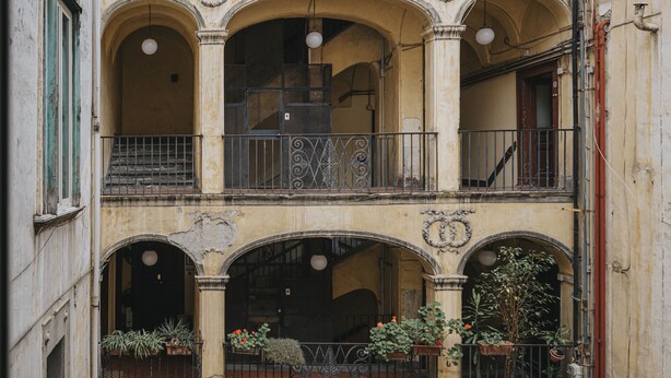 A multi-story building with balconies and arched windows. - Palazzo Pandola - Luxury Suites (Naples)