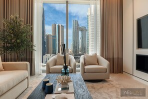Elite Apartment, Balcony, City View | Living area | 65-inch Smart TV with cable channels, Netflix, streaming services - WelHome - Luxurious 2BR Apt in Forte T1 Downtown (Dubai)