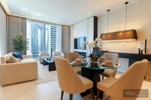 Elite Apartment, Balcony, City View | Living area | 65-inch Smart TV with cable channels, Netflix, streaming services - WelHome - Luxurious 2BR Apt in Forte T1 Downtown (Dubai)