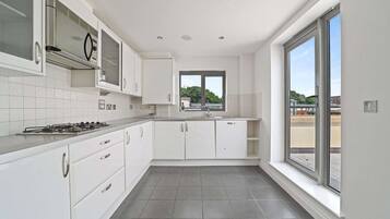 Apartment | Private kitchen | Fridge, microwave, oven, stovetop