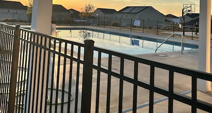 5 bedroom spacious home, with charcoal grill and seating. Peaceful neighborhood.