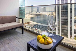 Enjoy a panoramic view of the marina and cityscape from the balcony.