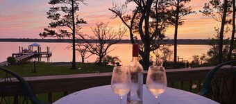 Secluded waterfront fishing cabin, boat dock, pier, sunsets, boat to beach