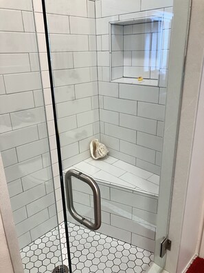 Shower, hair dryer, towels, shampoo