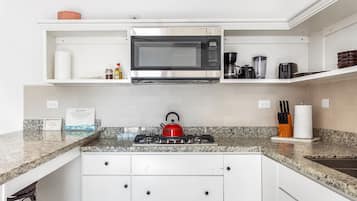Fridge, microwave, stovetop, coffee/tea maker