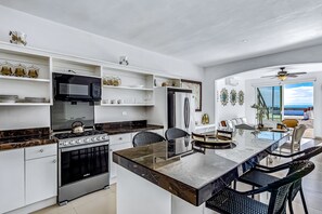 Fridge, microwave, oven, stovetop - Dog-friendly ocean-view retreat with pool access plus rooftop deck, AC (Rosarito)