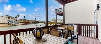 Channel-front townhome with chef's kitchen, kayaks, & game room - dog-friendly