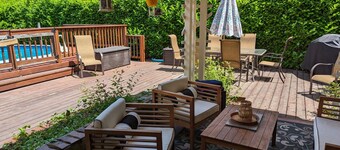 Tranquil, walkable home with seasonal pool, beautiful gardens & 2 patios