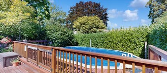 Tranquil, walkable home with seasonal pool, beautiful gardens & 2 patios