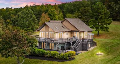 Updated lakefront home & studio with water views, beach, dock & game room