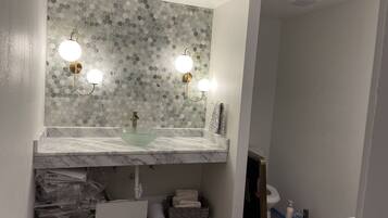 Shower, hair dryer, towels, toilet paper