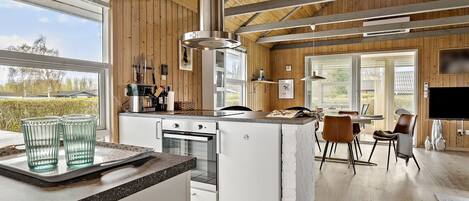 Fridge, stovetop, dishwasher, coffee/tea maker
