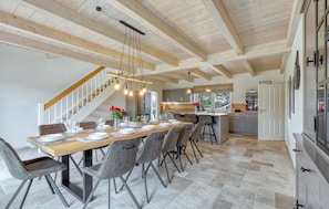 Enjoy meals in this spacious dining area with a table for six and comfortable seating.