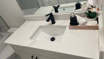 Hair dryer, towels, soap, shampoo