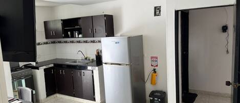 Fridge, cookware/dishes/utensils, lobster pot, dining tables