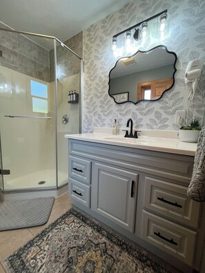 Shower, hair dryer, towels, soap