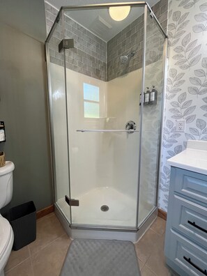 Shower, hair dryer, towels, soap