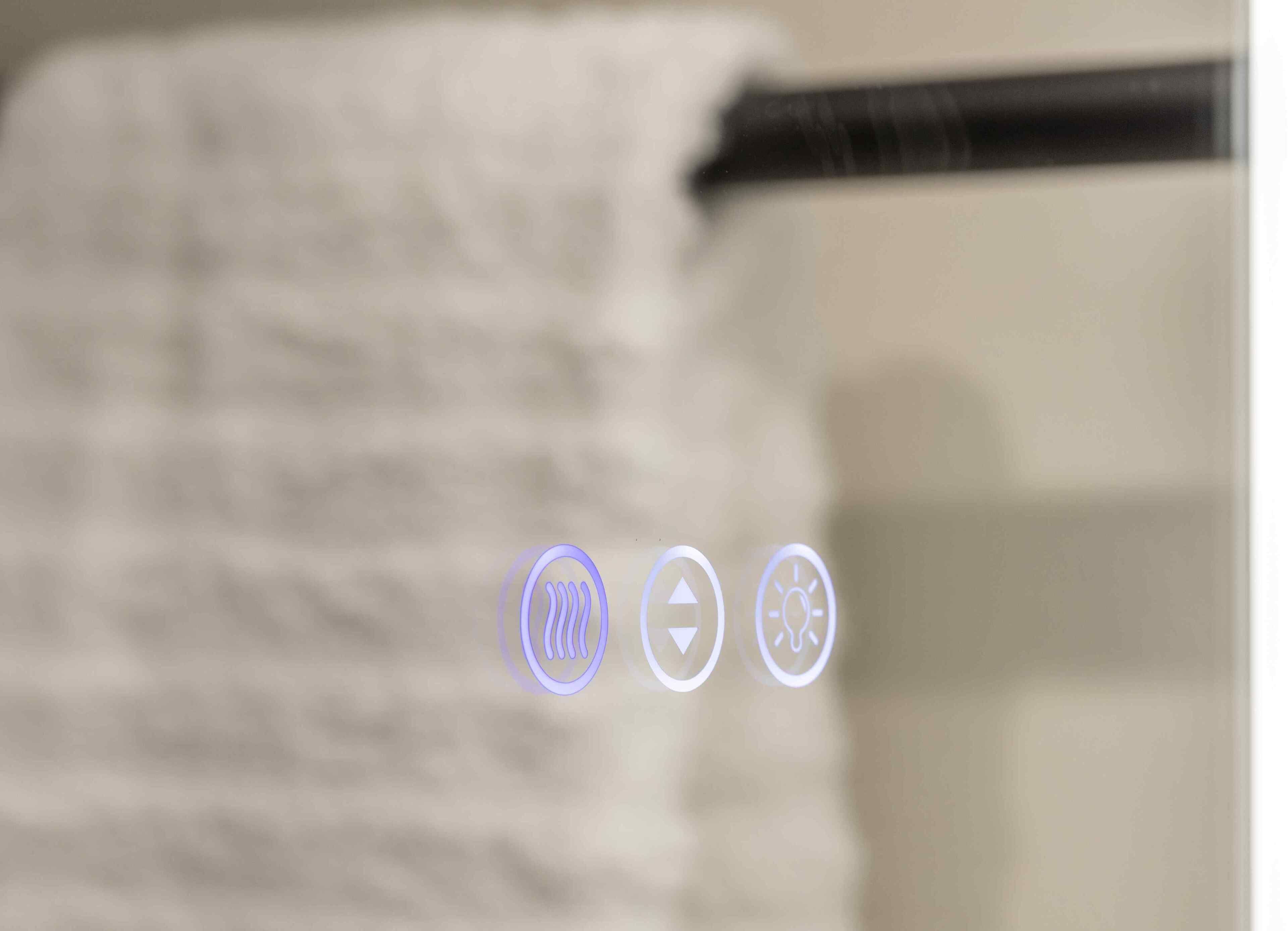 A close-up of a white towel hanging on a rack with a black handle.