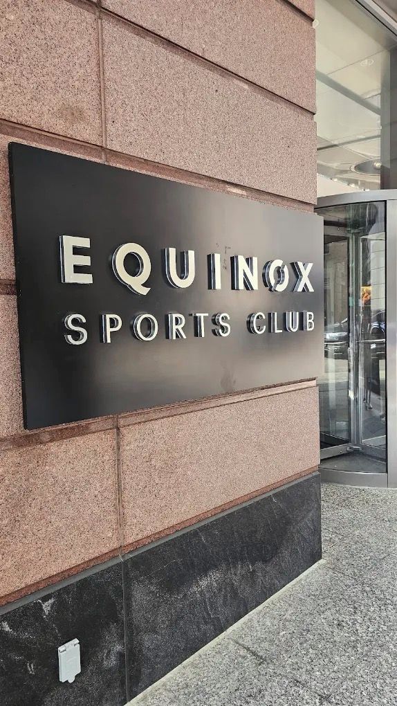 A sign for Equinox Sports Club.