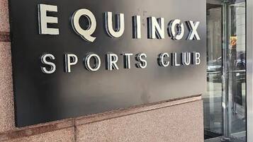 A sign for Equinox Sports Club.