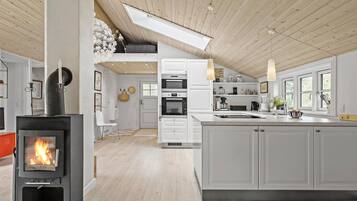 Fridge, stovetop, dishwasher, coffee/tea maker