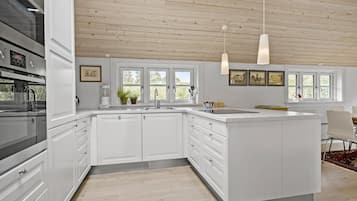 Fridge, stovetop, dishwasher, coffee/tea maker