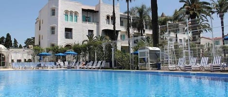 Seasonal outdoor pool, pool umbrellas, pool loungers