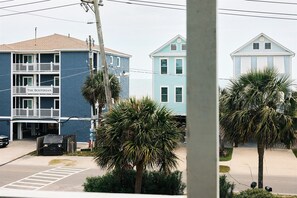A coastal building with a balcony and a sign that reads "The Bostonian." - Top Floor Surfside Beach Condo with Pool & Easy Beach Access, Pets Welcome  (Surfside Beach)