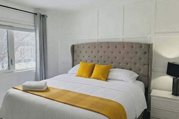 King size bed featuring a comfortable mattress, and high quality bedding
