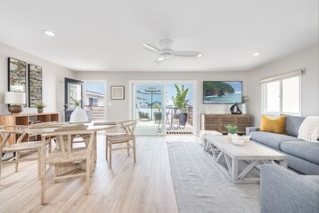 Centrally located, steps from the shore, this newly remodeled upstairs unit is perfectly situated. Walk to dining, attractions, and parks. It's one of three units on the property.
                