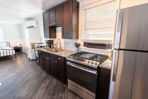 Fridge, microwave, oven, stovetop - Florida Room: Walk DNTN | Studio | Lux Bath | Pet Welcome (Gainesville)