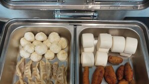 A stainless steel buffet with various food items including dumplings, rolls, and sausages. - Yizhi Hotel Panyu Plaza Shiqiao Subway   (Guangzhou)