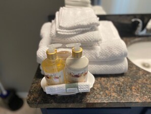 Hair dryer, towels, soap, shampoo