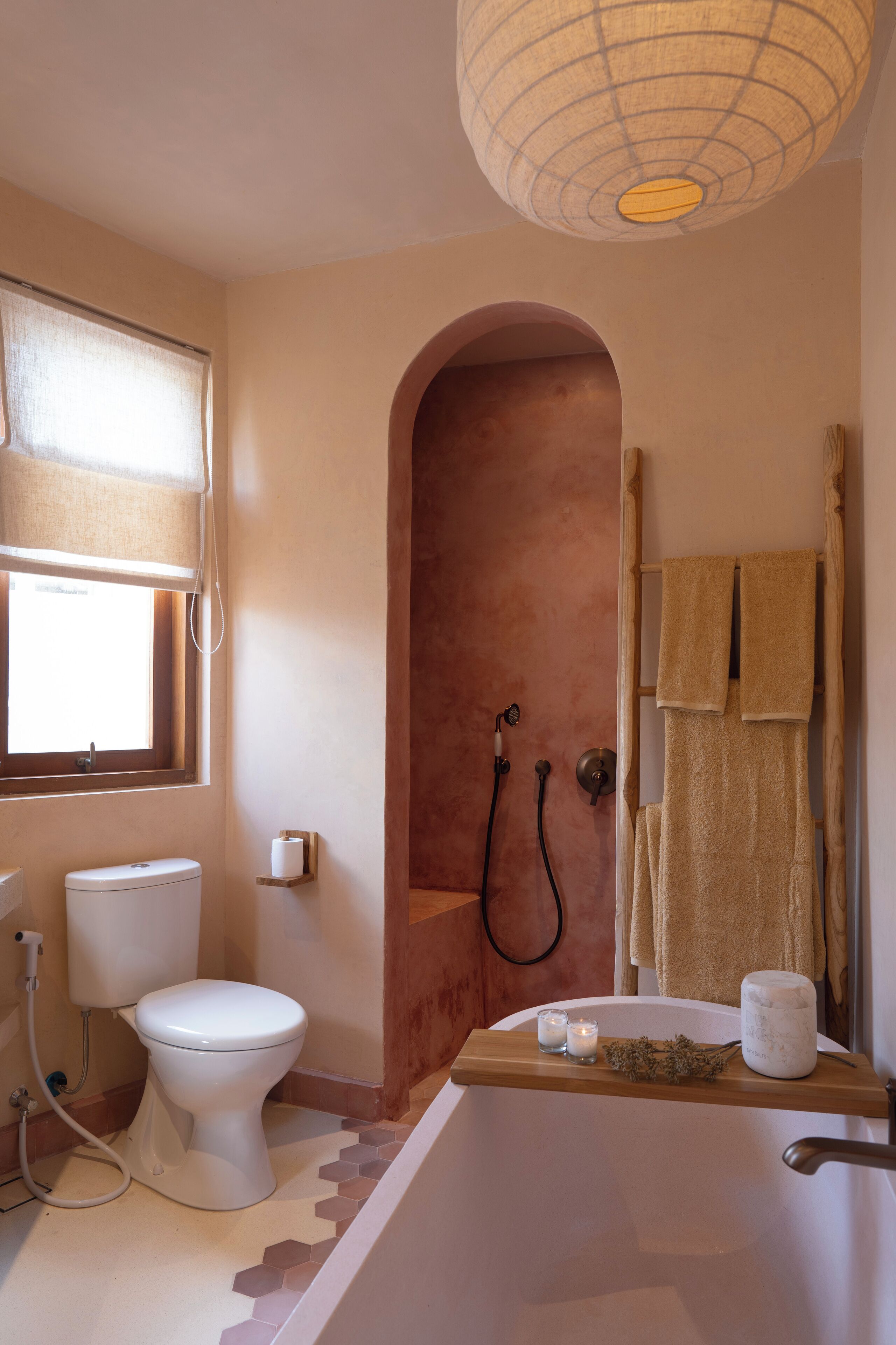 A bathroom with a toilet, a shower, and a bathtub.