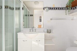 Shower, hair dryer, towels, shampoo