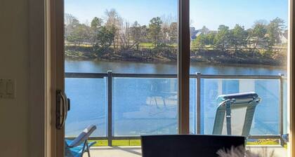 Condo with riverfront view - close to beaches & town - walk everywhere