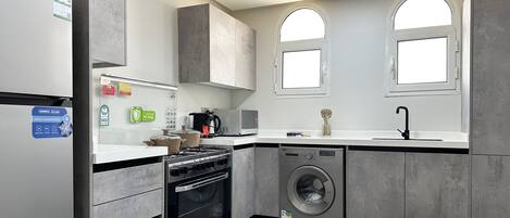 Design Apartment, 3 Bedrooms | Private kitchen | Coffee/tea maker, electric kettle