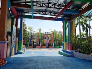 A colorful entrance with a covered walkway and a central archway.