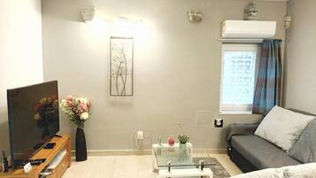 Apartment (Two bedroom Apartment) | Living room | 32-inch flat-screen TV with digital channels