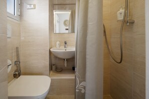 Shower, eco-friendly toiletries, hair dryer, towels