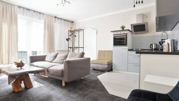 Family Apartment | Living area | Flat-screen TV