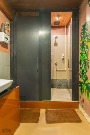 Monstera room (Female dorm) | Bathroom | Hair dryer, bidet, towels, soap - Forrest Hostels (Mumbai)