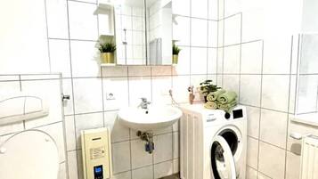 Shower, towels, soap, toilet paper