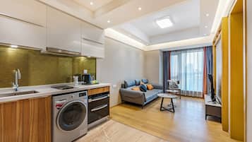 Suite de lujo, 1 habitación, para no fumadores, vista a la ciudad | Área de sala de estar