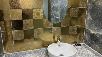 Shower, rainfall showerhead, hair dryer, towels