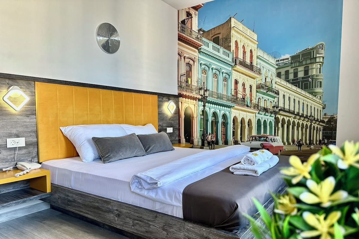 Deluxe Room | 1 bedroom, in-room safe, individually decorated, individually furnished
