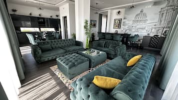 Elite Apartment | Living area | Flat-screen TV