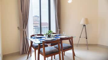 Deluxe Apartment, 2 Bedrooms | Living area | 46-inch flat-screen TV with cable channels, pay films