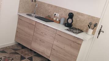 Fridge, microwave, stovetop, coffee/tea maker